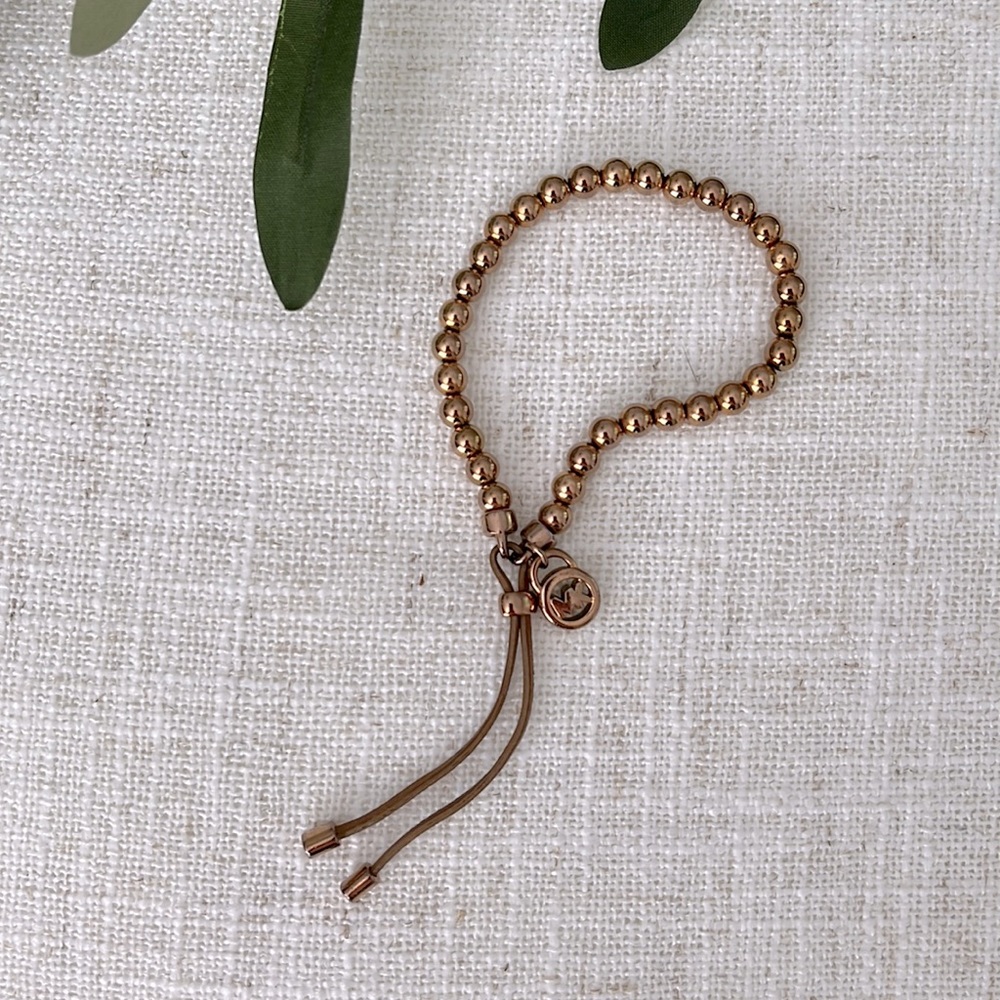 - Michael Kors stretch  bracelet copper color any questions just ask
